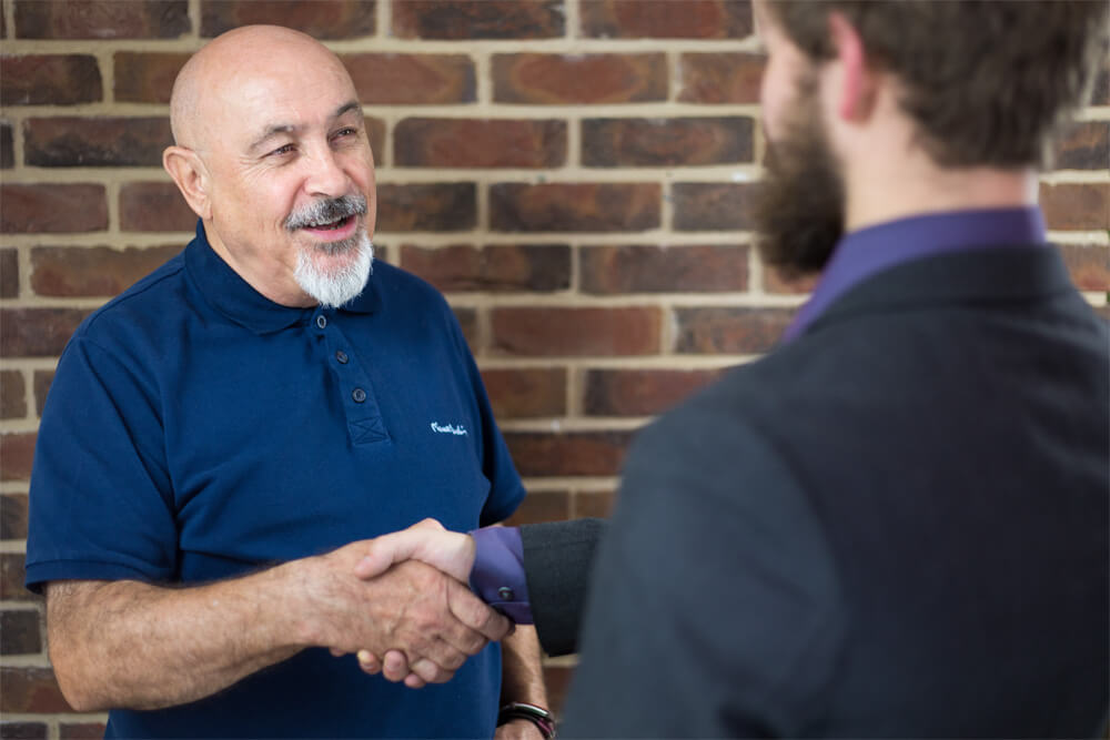 Two men shaking hands.