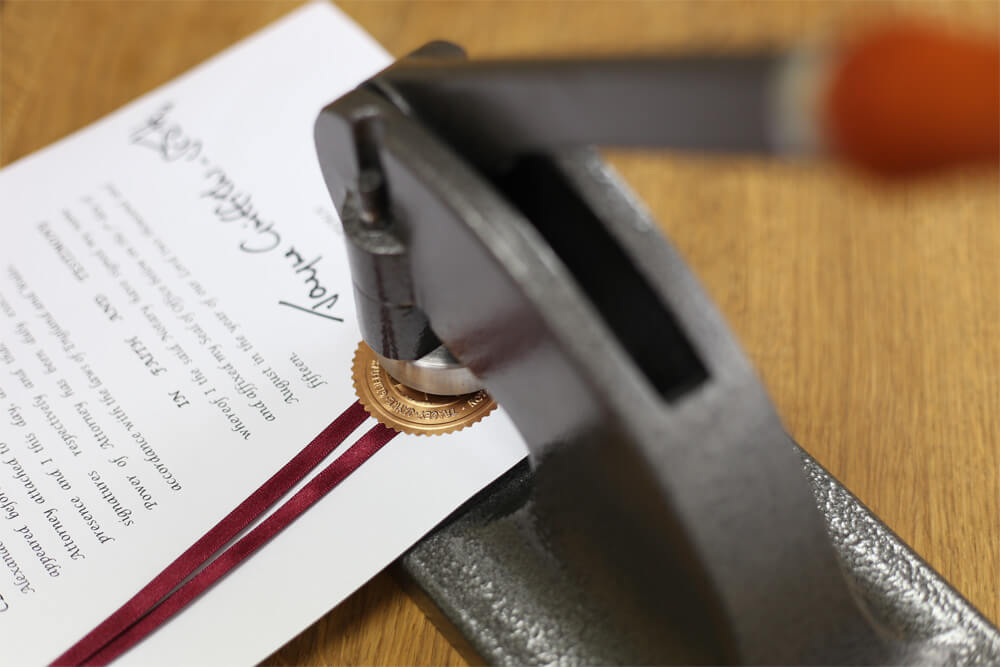 A document in a notary embosser.